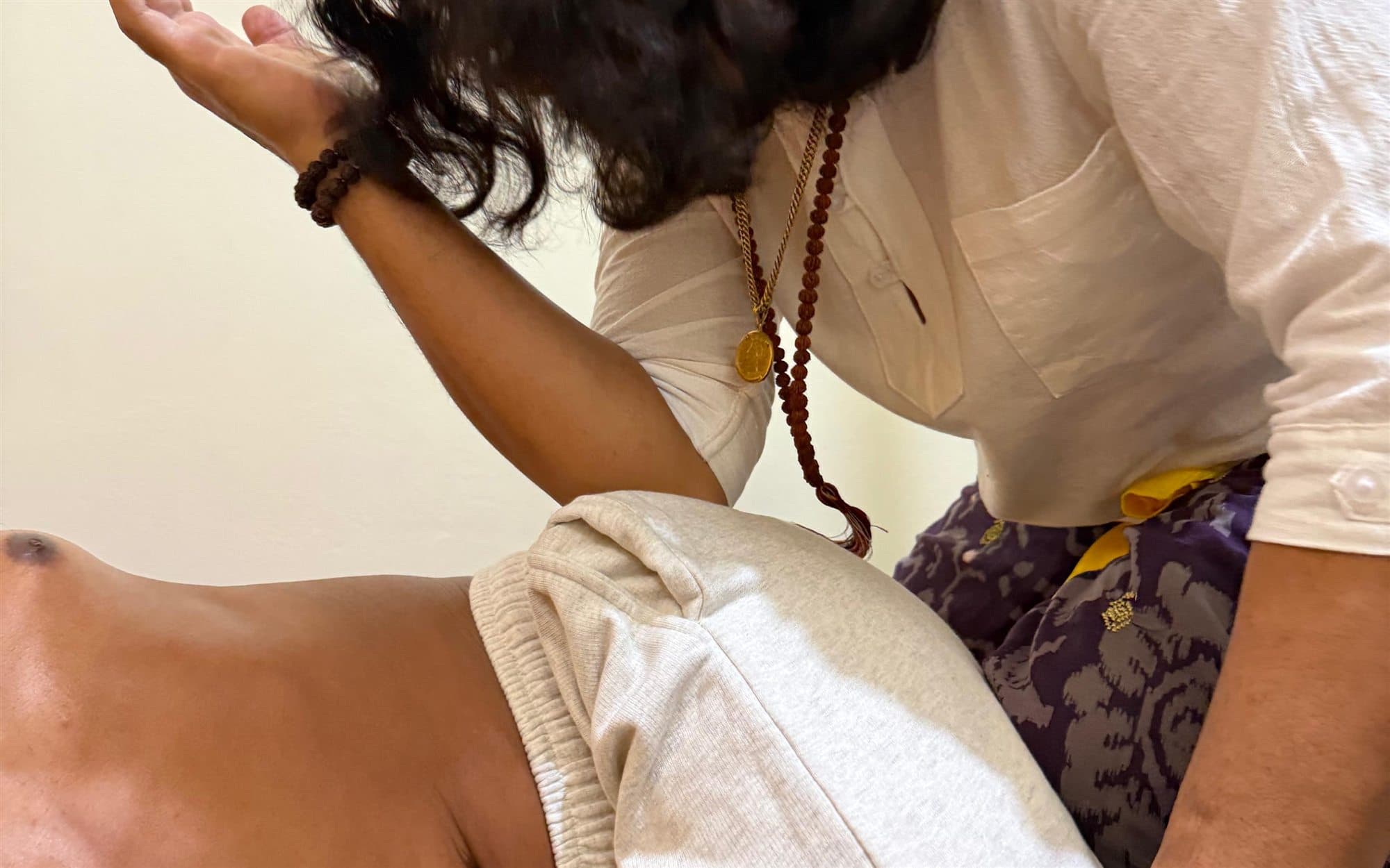 JRO giving a traditional Balinese healing treatment to a client.
